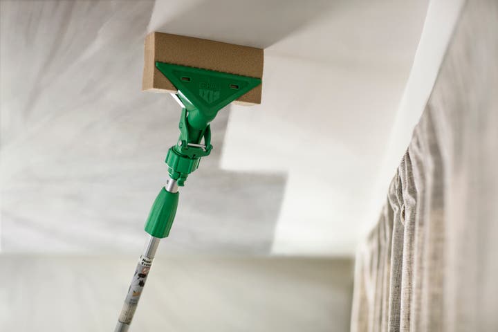 Removing smoke damage from ceiling with mop
